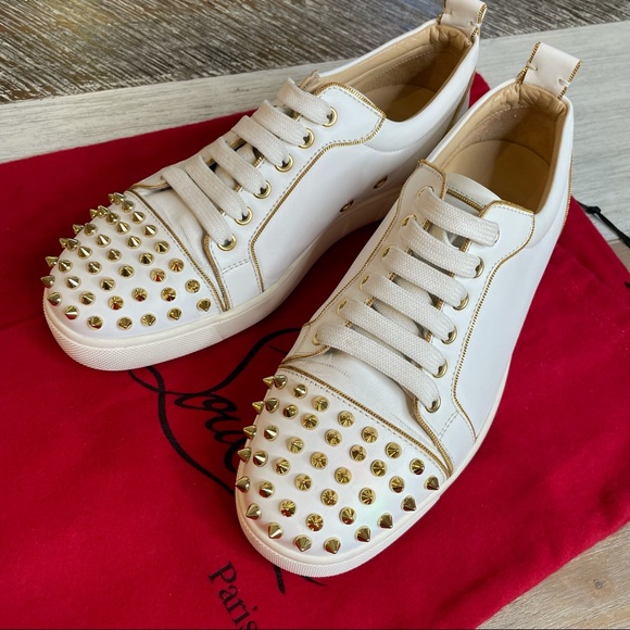 red bottom studded sneakers